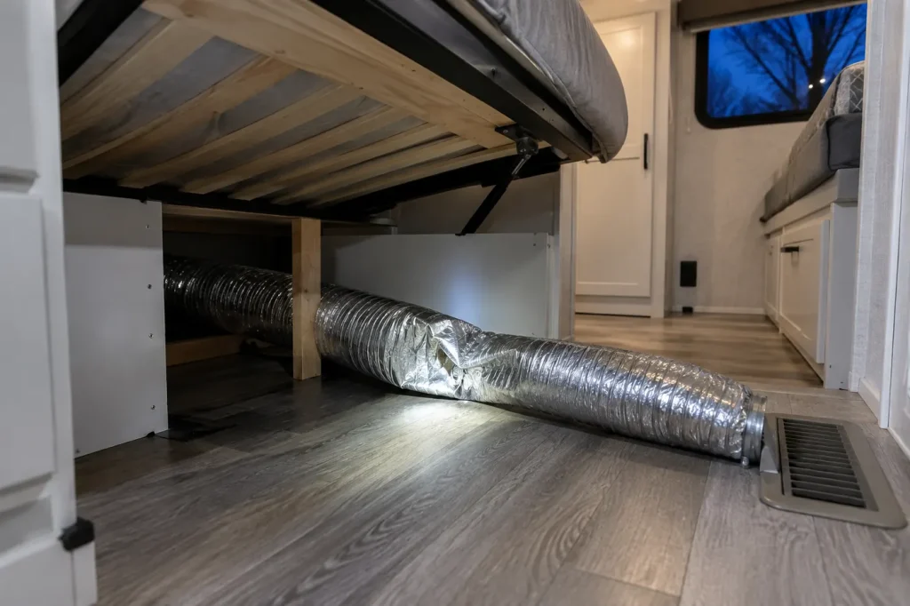 Kinked flex heating duct under an RV bed restricting furnace airflow